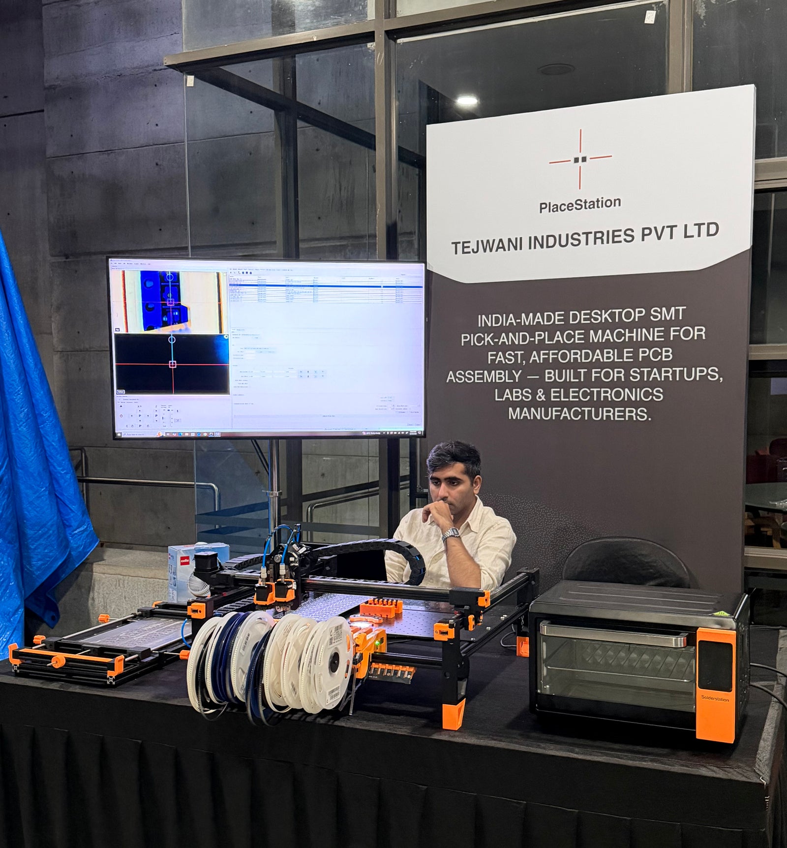 PlaceStation at a trade show with feeders and the SolderStation reflow oven